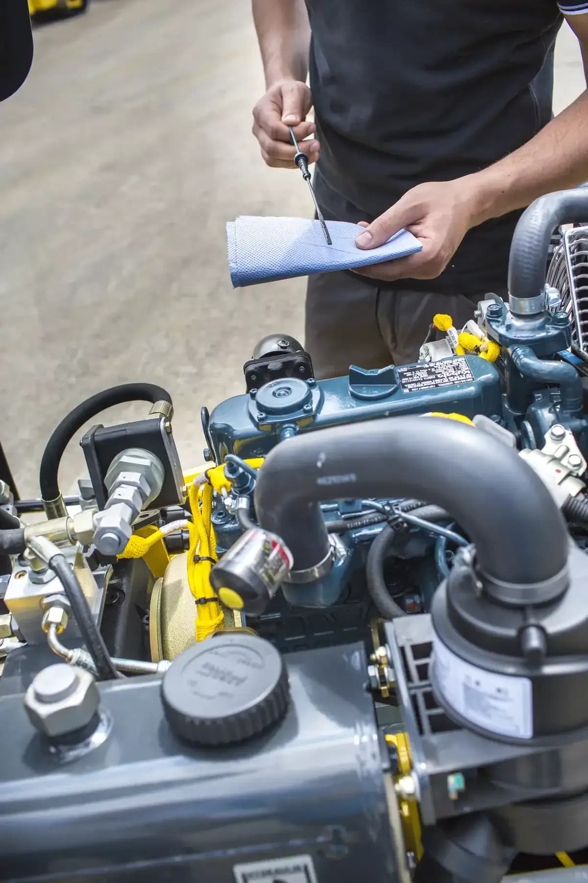 Technician inspecting an engine component