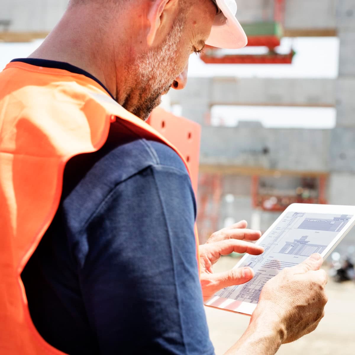 Contractor reviewing plans on a jobsite